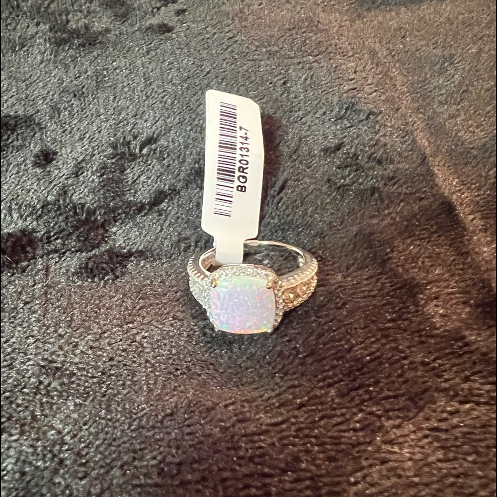 Beautiful sterling silver lab created fire opal and cz ring. Size 7.